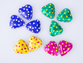 Chocolate or Colorful heart shape chocolate on a background.