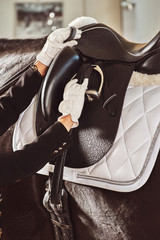 woman jockey with his horse