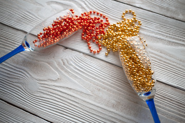 new years eve party table with champagne. Champagne glasses. Celebration theme. New dekor- beads,...