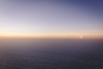 colorful gradient sky just before sunrise view form airplane with copyspace