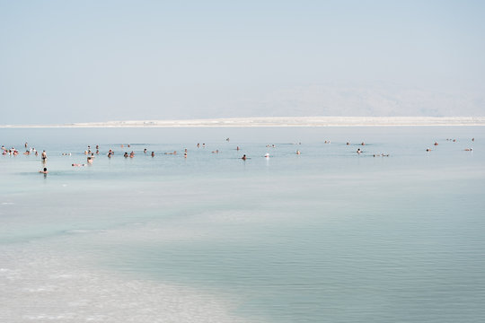 Swimmers in Dead sea at Ein Bokek, Israel.