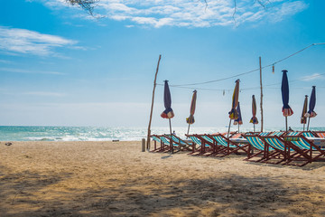 Chairs and umbrella on a beautiful tropical beach