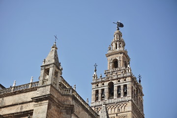 Giralda, famous bell tower of the Seville Cathedral in Spanish city of Sevilla, built as a minaret and rebuilt as a tower of famous church as a symbol of Arab and Moorish architectural period in Spain