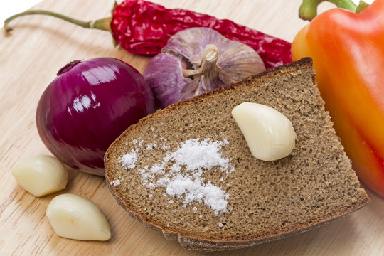 Salt on rye bread and vegetables