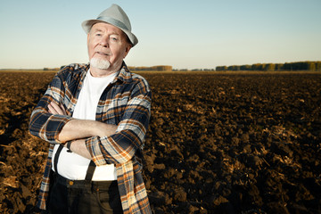 farmer in a plowed field