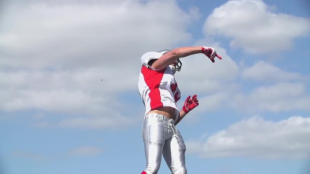 Footballer throws ball