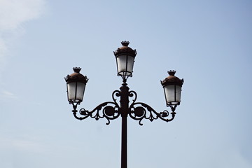 Typical Spanish decorated street lamp and lantern as a symbol of antiquated Spanish design and...