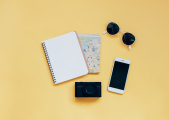 Travel items concept : blank notebook, map, camera, smartphone a
