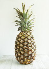pineapple on wood table