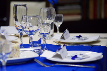 Table setting Cutlery in blue and white tones of the decor. Strict ceremonial meal. Menu luxury for the person. Table for the visitors in the restaurant.