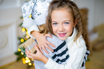 Two girl, gift, Christmas tree, white hats