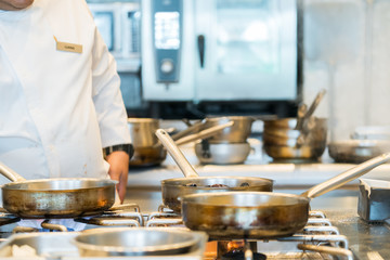 chef preparing food in a restaurant kitchen
