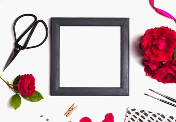 Empty frame and roses, top view.