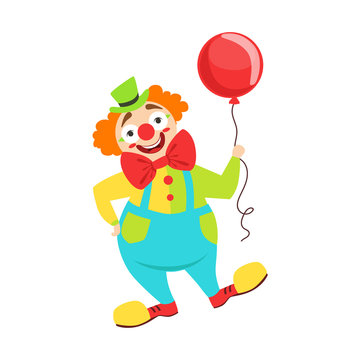 Circus Clown Artist In Classic Outfit With Red Nose And Make Up Holding A Balloon In The Circus Show