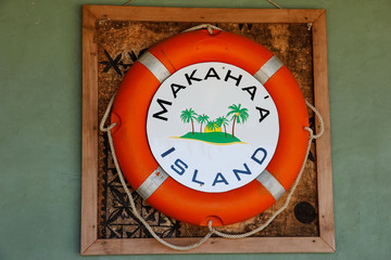Life bouy on the wall at Makaha'a island near Tongatapu island i