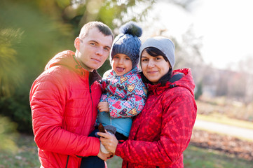 Fototapeta premium The family walks in the Park in autumn