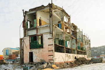 Tyumen, Russia - February 16, 2008: Demolition of machine-tool factory. Shell of partially demolished building