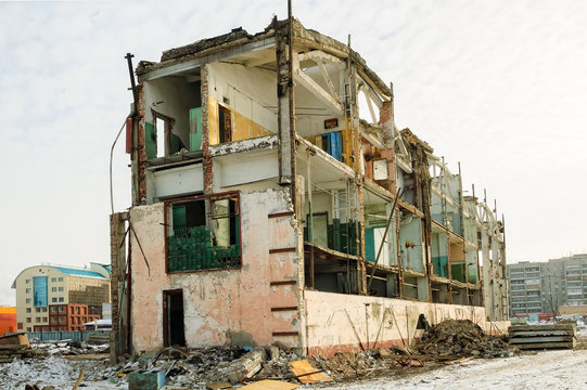 Tyumen, Russia - February 16, 2008: Demolition of machine-tool factory. Shell of partially demolished building