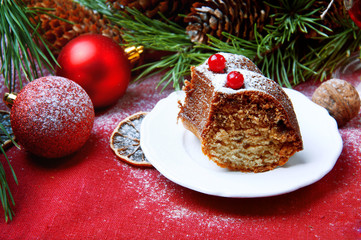 Fototapeta na wymiar Christmas table setting. Bundt cake sprinkled with sugar powder.