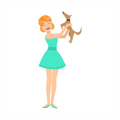 Pretty Girl In Blue Dress Playing With Her Smal Brown Pet Dog, Part Of Women Different Lifestyles Collection