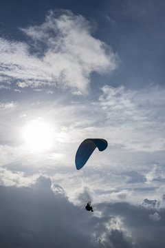 paragliding on the blue sky