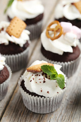 Chocolate cupcakes on a grey wooden table