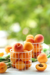Ripe apricots fruit on white wooden table