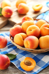Ripe apricots fruit on grey wooden table