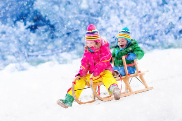 Fototapeta na wymiar Kids having fun on sleigh ride