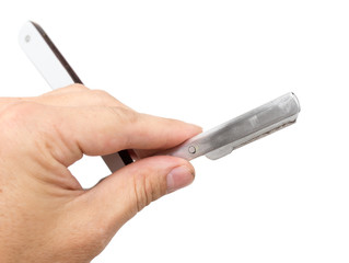 razor in his hand on a white background