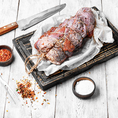 Raw beef with spices twine tied in bundle