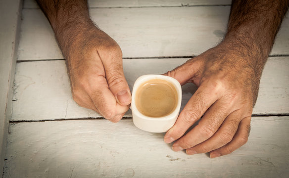 Holding cup of coffe