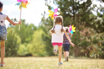 Kids playing with pinwheels
