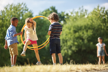 Girl jumps through hula hoop