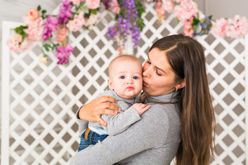 Mother holding sweet baby boy