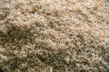 shavings. Wood timber construction material for background and texture. carpentry waste after processing. wood, raw material for heating. wood structure.  joinery
