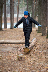 A boy on a log