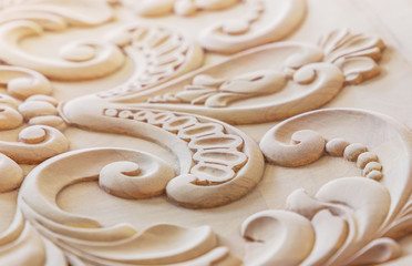 Wood processing. Joinery work. wood carving. the carving element. close up. small depth of field. use as background