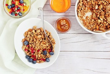 Breakfast set with granola, fruits salad, fresh juice and various of topping. Healthy eating concept.