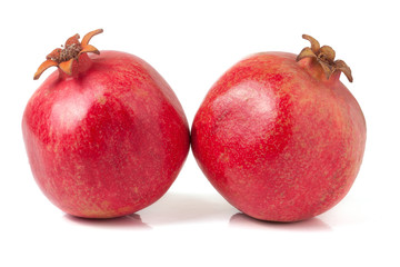 Fototapeta premium two pomegranate isolated on a white background