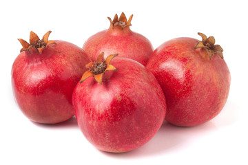 four pomegranate isolated on a white background