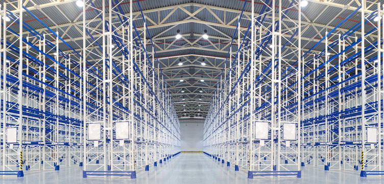 Empty huge distribution warehouse with high shelves