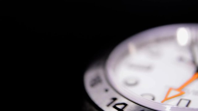 Extreme close-up of white luxury watch in a watch winder
