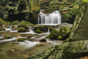 Autumn waterfalls with stones