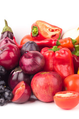 Set of red and purple fresh raw vegetables and fruits