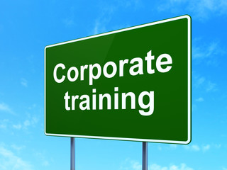 Studying concept: Corporate Training on road sign background