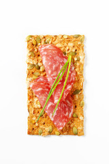 pumpkin seed cracker with dry salami