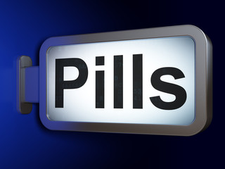 Healthcare concept: Pills on billboard background