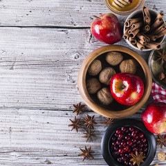 apple and spices on a background of the old wooden table