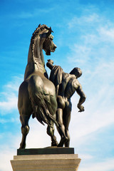 VIENNA, AUSTRIA - MAY 5, 2009: The bronze sculpture of Man with the horese in front of Parliament by J. Lax (1897 - 1900).